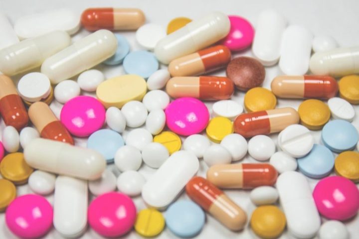 Assorted prescription medication pills and capsules representing the differences between compounded and brand-name GLP-1 drugs